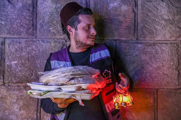 In Pictures: Volunteers and a 'Musaharati' Deliver Pre-Dawn Meals in Syria