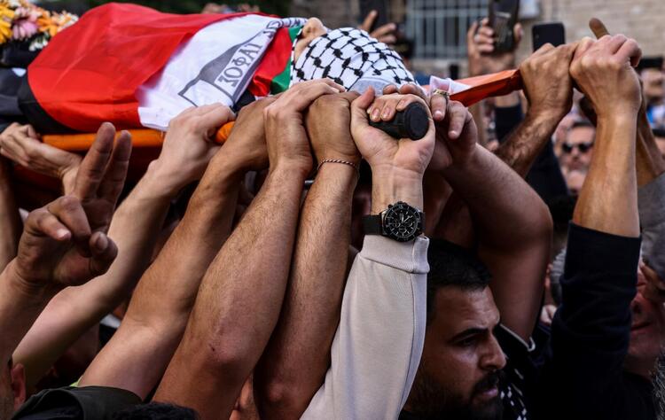 In Pictures: Funerals Held After Palestinian Journalist Killed