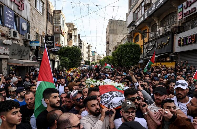 In Pictures: Funerals Held After Palestinian Journalist Killed