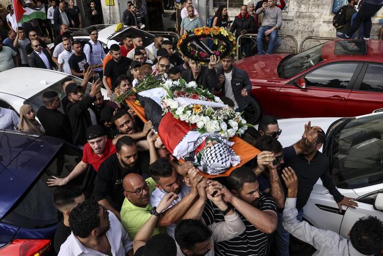 In Pictures: Funerals Held After Palestinian Journalist Killed