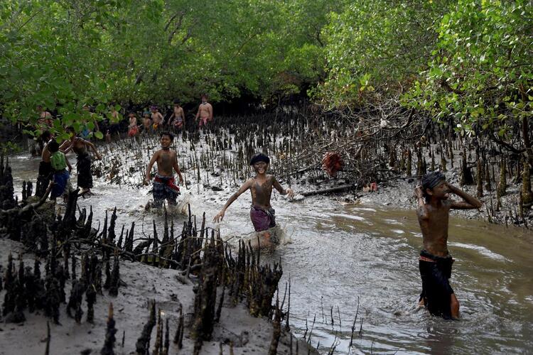 In Pictures: The Balinese Mud Bath Tradition of Mebuug-Buugan