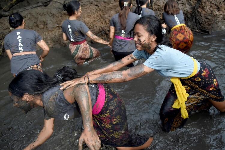 In Pictures: The Balinese Mud Bath Tradition of Mebuug-Buugan