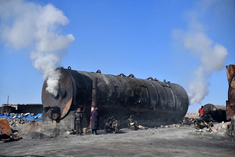 In Pictures: Syrian Children Work at Oil Refinery to Get By