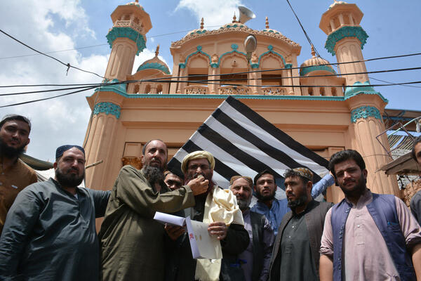 "Activists of Jamiat Ulama-e-Islam Nazryati party celebrate in Quetta on August 31, 2021, after the US pulled all its troops out of Afghanistan"