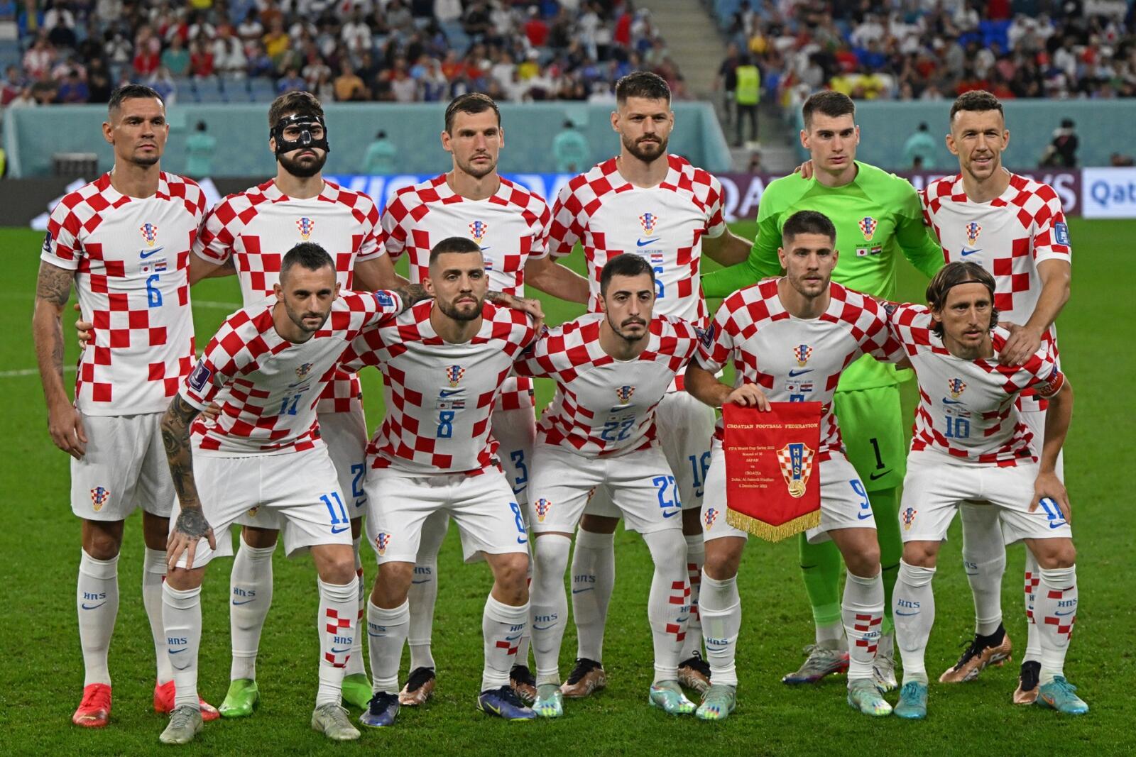 Croatia's players pose for a group picture at the start of the Qatar 2022 World Cup round of 16 football match between Japan and Croatia at the Al-Janoub Stadium in Al-Wakrah, south of Doha on December 5, 2022. (Photo by OZAN KOSE / AFP)