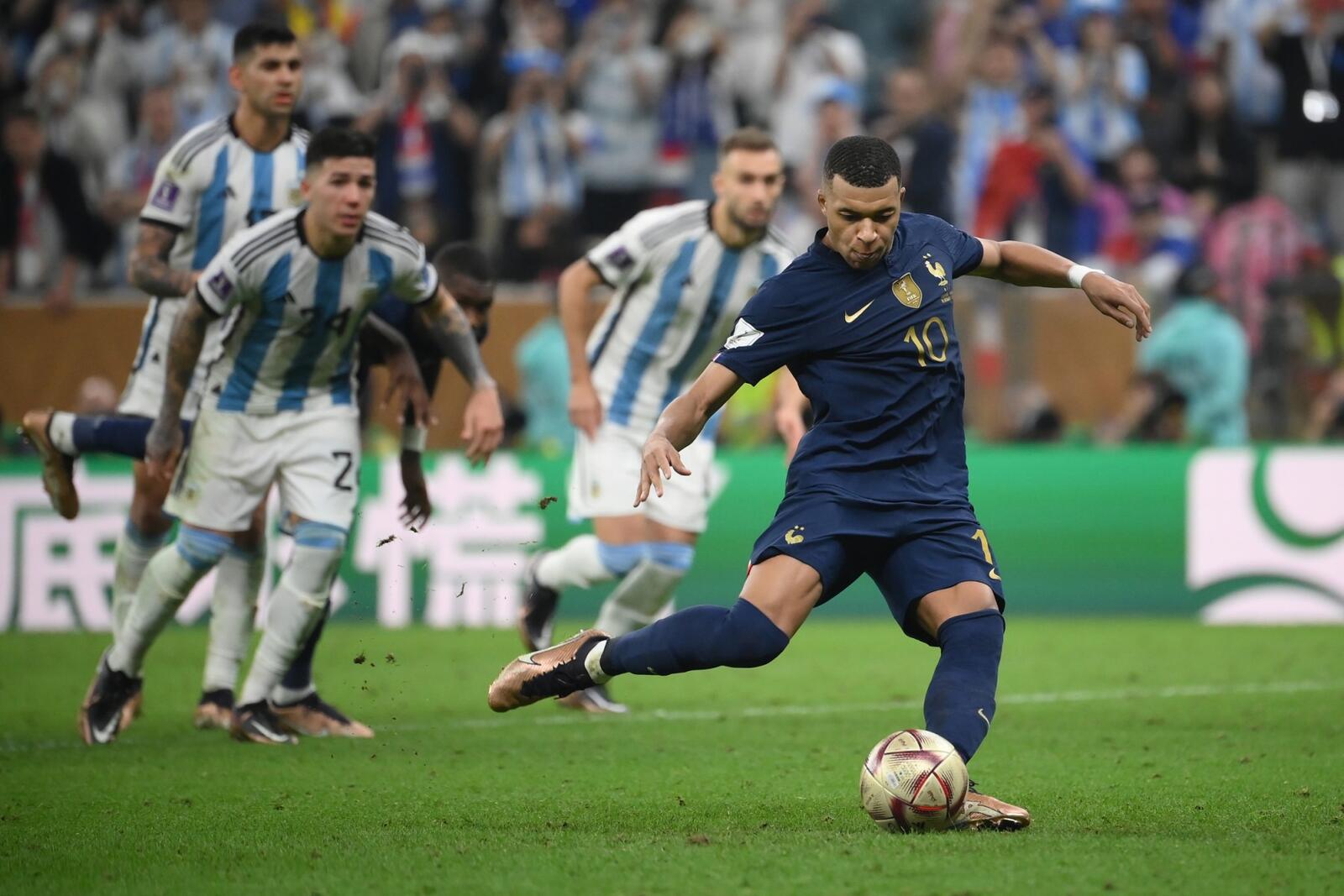 France's forward #10 Kylian Mbappe takes a penalty to score his team's third goal from the penalty spot during the Qatar 2022 World Cup football final match between Argentina and France at Lusail Stadium in Lusail, north of Doha on December 18, 2022. (Photo by FRANCK FIFE / AFP)