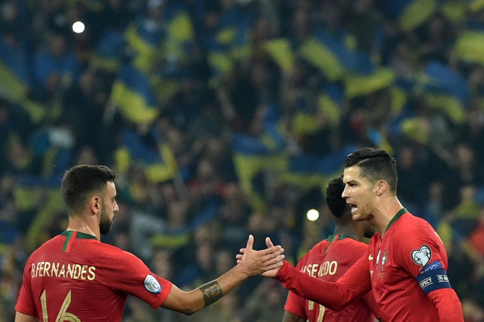Fernandes and Ronaldo (Photo: AFP)