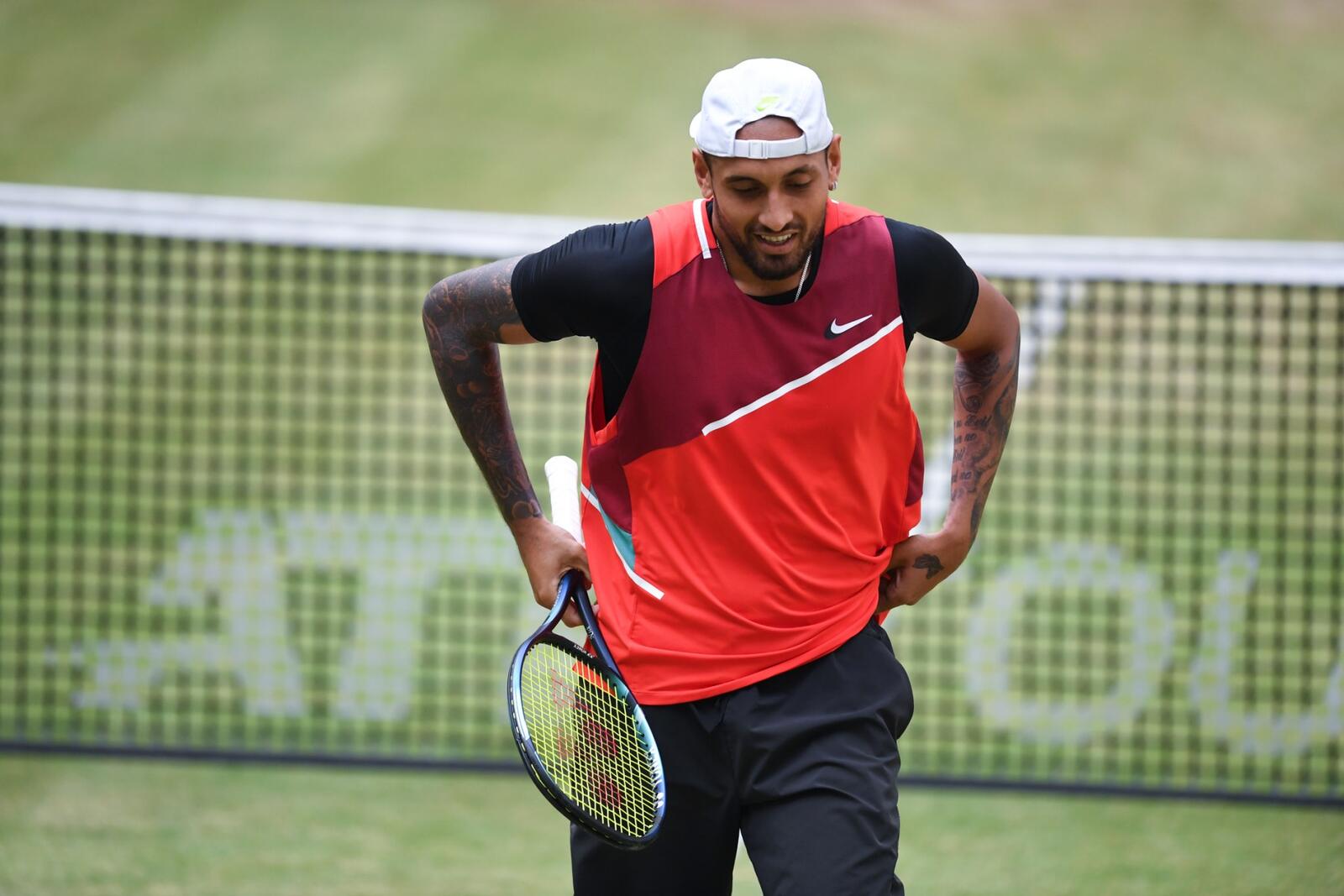 Australia's Nick Kyrgios reacts during his match against Poland's Hubert Hurkacz during their men's singles semi-final tennis match at the ATP 500 Halle Open tennis tournament in Halle, western Germany, on June 18, 2022. (Photo by Carmen JASPERSEN / AFP)