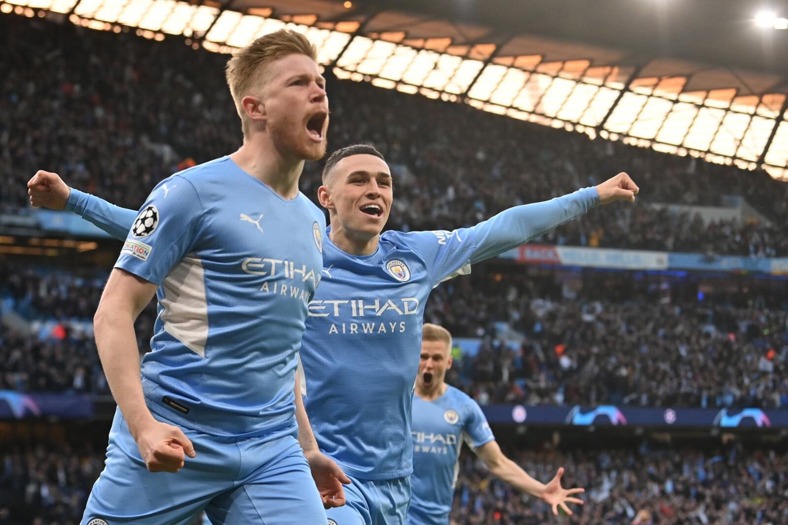 Manchester City's Belgian midfielder Kevin De Bruyne celebrates after scoring a goal during the UEFA Champions League semi-final first leg football match between Manchester City and Real Madrid, at the Etihad Stadium, in Manchester, on April 26, 2022. (Photo by Paul ELLIS / AFP)
