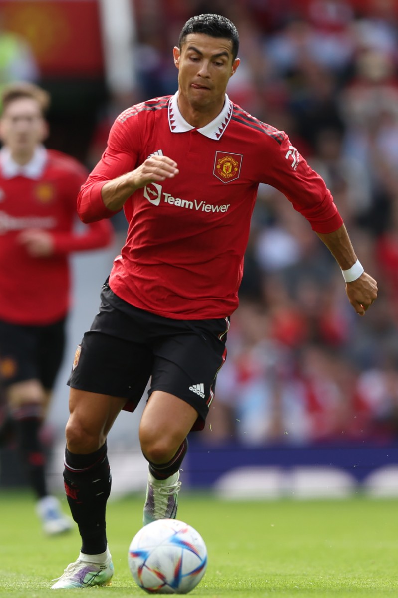 Manchester United's Portuguese striker Cristiano Ronaldo runs with the ball during a pre-season club friendly football match between Manchester United and Rayo Vallecano at Old Trafford in Manchester, north west England, on July 31, 2022. (Photo by Nigel Roddis / AFP)