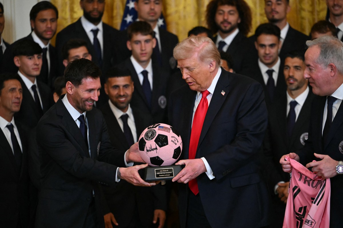 Donald Trump Lionel Messi Photo by ANDREW CABALLERO-REYNOLDS / AFP