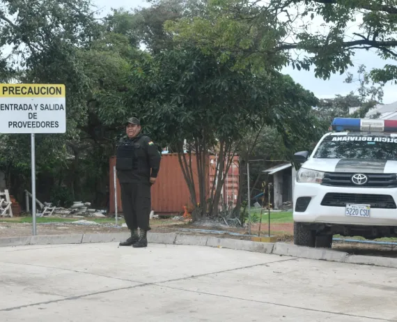 Policeman standing guard outside the hospital where Beller lies.
