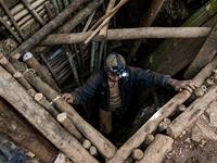This photo taken on May 16, 2019 shows a miner entering a tunnel in a ruby mine in Mogok, north of Mandalay. Burrowing deep underground, thousands of informal miners risk their lives to find gleaming red gems as a law change spurs opportunity in Myanmar's "land of rubies". Ye Aung THU / AFP