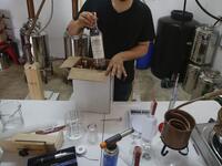 Palestinian distiller Nader Muaddi packages his Arak bottles in the West Bank village of Beit Jala, near Bethlehem, on June 16, 2019. In his basement, distiller Muaddi made fewer than 500 bottles of liquor last year, but it is earning global acclaim and reviving interest in the Palestinian alcohol sector. On the outskirts of the city famed for Jesus's birth, the 35-year-old illustrates the handcrafted way he makes Arak, an anise-flavoured drink popular in the Middle East and similar to Greek Ouzo, French Pa