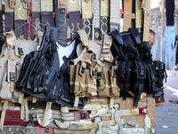 Tactical vests are pictured on display at a shop in Yemen's third city of Taez, on July 13, 2019. Before the war, the old market of Taez was crowded with people and was full of handcrafts and artisanal goods. AHMAD AL-BASHA / AFP