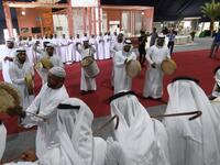 Emirati musicians perform during the annual Liwa Date Festival in the western region of Liwa on July 17, 2019. The Liwa Date Festival aims to preserve Emirati heritage, specifically palm trees and half-ripe dates, knows as "ratab", which are deep-rooted in the Gulf country's traditions. Karim SAHIB / AFP