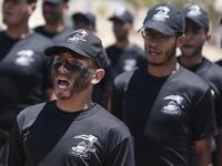 Palestinian military cadets take part in a training session organised by Hamas' military wing, the Ezzedin al-Qassam Brigades, in Gaza City on July 20, 2019.  MAHMUD HAMS / AFP
