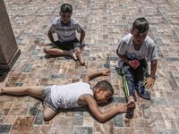 Palestinian amputee children rest during a summer camp origanized by the Palestinian Children's Relief Fund (PCRF) in the town of Khan Yunis in the southern Gaza strip on August 3, 2019. The PCRF is a non-governmental organisation providing physical and psychological services for disabled children in Gaza Strip. SAID KHATIB / AFP