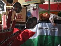 View of parts of objects used by Mexican activist Julia Klug in protests, including a flag reading "Free Palestine" in Mexico City on August 08, 2019. RODRIGO ARANGUA / AFP