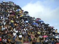 Rohingya refugees attend a ceremony organised to remember the second anniversary of a military crackdown that prompted a massive exodus of people from Myanmar to Bangladesh, at the Kutupalong refugee camp in Ukhia on August 25, 2019. MUNIR UZ ZAMAN / AFP