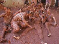 Revellers covered in tomato pulp take part in the annual "Tomatina" festival in the eastern town of Bunol, on August 28, 2019. JAIME REINA / AFP