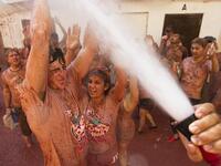 The iconic fiesta, which is billed at "the world's biggest food fight" has become a major draw for foreigners, in particular from Britain, Japan and the United States. JAIME REINA / AFP