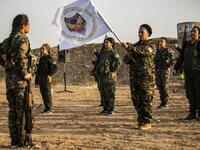 Members of the Bethnahrin Women Protection Forces (HSNB), an all-female Syriac-Assyrian paramilitary group under the umbrella of the Syrian Democratic Forces (SDF), line-up as they commemorate the fourth anniversary of their creation, in the countryside of the town of Tall Tamr in the northwestern Syrian province of Hasakah, on August 30, 2019.  Delil SOULEIMAN / AFP
