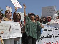 Palestinian women protest in support of women’s rights outside the prime minister’s office in the West Bank city of Ramallah on, after a young Palestinian died in a case that has raised emotions.  ABBAS MOMANI / AFP
