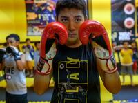 In this photograph taken on August 29, 2019, children from Muslim Uighur minority take part in a Muay Thai training session in Istanbul. BULENT KILIC / AFP