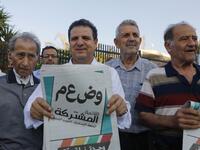Ayman Odeh, head of the Arab Joint List alliance, holds his pamphlets during a campaign rally in the Arab Israeli city of Tira, north of Tel Aviv, on September 5, 2019 . AHMAD GHARABLI / AFP