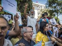 Demonstrators chant slogans and speak to the media as they gather outside a courthouse holding the trial of Hajar Raissouni, a Moroccan journalist of the daily newspaper Akhbar El-Youm, on charges of abortion, in the capital Rabat on September 9, 2019. FADEL SENNA / AFP
