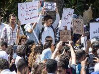 Demonstrators hold up signs showing the portraits of Hajar Raissouni, a Morrocan journalist of the daily newspaper Akhbar El-Youm. FADEL SENNA / AFP