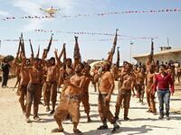 Syrian Turkish-backed fighters from al-Mutasim Brigade react after finishing their training at a camp near the town of Marea in Syria's northern Aleppo district, on September 12, 2019. Nazeer Al-khatib / AFP