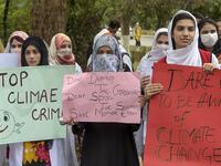 Students hold placards as they march for a climate strike to protest against governmental inaction towards climate breakdown and environmental pollution, part of demonstrations being held worldwide in a movement dubbed "Fridays for Future", in Peshawar on September 20, 2019. ABDUL MAJEED / AFP