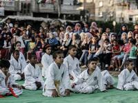 Young Palestinian karatekas attend a Karate promotion ceremony at a sporting centre in the Rafah camp for Palestinian refugees in the southern Gaza Strip on September 20, 2019. SAID KHATIB / AFP