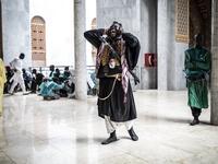 A Baye Fall disciple chants after entering the Great Mosque of the Mourides on September 27, 2019 in Dakar, ahead of its inauguration. Senegal's influential Mouride Brotherhood will inaugurate a 30,000-capacity mosque in the capital Dakar, said to be the largest in West Africa. JOHN WESSELS / AFP