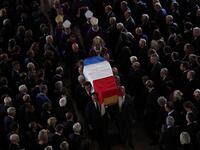 The coffin of the late French president Jacques Chirac is carried from the Saint Sulpice Church in the French capital Paris to a waiting hurst following his funeral service on September 30, 2019.  Francois Mori / POOL / AFP