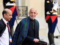 Former Afghan President Hamid Karzai (C) gestures as he leaves The Elysee Presidential Palace in Paris on September 30, 2019, following a luncheon after a church service for former French President Jacques Chirac. Former French President Jacques Chirac died on September 26, 2019 at the age of 86. Bertrand GUAY / AFP