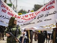A member of the Kurdish Internal Security Police Force stands guard during a demonstration in front of the United Nations offices in the Kurdish-majority city of Qamishli in northeast Syria on October 2, 2019 over the Kurds exclusion from the UN-backed constitutional committee. Delil SOULEIMAN / AFP