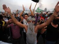 Iraqi protesters chant slogans during a demonstration against state corruption, failing public services and unemployment at Tayaran square in Baghdad on October 2, 2019. Iraq's president and the United Nations urged security forces to show restraint after two protesters were killed in clashes with police that other top officials blamed on "infiltrators." AHMAD AL-RUBAYE / AFP