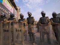 Iraqi riot police stand guard as protestors take part in a demonstration against state corruption, failing public services and unemployment, on October 2, 2019 in the southern city of Basra. Popular protests multiplied across Iraq today as thousands of demonstrators braved live fire and tear gas in rallies that have left seven dead in the past 24 hours. Hussein FALEH / AFP
