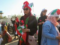 Iranian women attend the World Cup Qatar 2022 Group C qualification football match between Iran and Cambodia at the Azadi stadium in the capital Tehran on October 10, 2019. ATTA KENARE / AFP