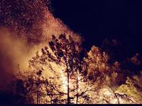 A massive fire in the Chouf village of Meshref spread to a nearby university and elementary school Monday. (Twitter)