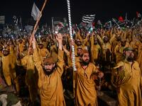  Supporters of Islamic political party Jamiat Ulema-e-Islam (JUI-F) react as they listen to the speech of their leader Maulana Fazlur Rehman during an anti-government "Azadi (Freedom) March" in Islamabad Aamir QURESHI / AFP