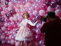 Instagram influencer "Anmaykaa" is being photographed at the "Supercandy Pop-Up Museum Vol. 2" in Cologne, western Germany on November 1, 2019. It is an interactive museum and offers a photo backdrop for social media at 25 stations. INA FASSBENDER / AFP