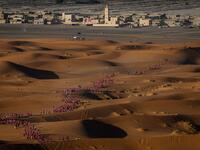Women take part in the desert trek "Rose Trip Maroc", on November 4, 2019 in the erg Chebbi near Merzouga. The Rose Trip Maroc is a female-oriented trek where teams of three must travel through the southern Moroccan Sahara desert with a compass, a map and a topographical reporter. JEAN-PHILIPPE KSIAZEK / AFP