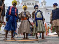 Sikh pilgrims gather as they take part in a ritual procession at a shrine in Nankana Sahib, some 75 kms west of Lahore on November 7, 2019, on the occasion of the 550th birth anniversary of Guru Nanak Dev. A corridor that will allow Sikhs to cross from India into Pakistan to visit one of the religion's holiest sites is set to open on November 9, with thousands expected to make a pilgrimage interrupted by decades of conflict. Arif ALI / AFP