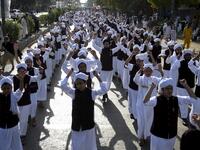 Muslim devotees take part in a procession to celebrate the birthday of Prophet Mohammed, in Karachi on November 10, 2019. The birthday of Prophet Mohammed, also known as 'Milad', is celebrated during the Islamic month of Rabi al-Awwal, which falls on 12 Rabi al-Awwal in Islamic calendar. Rizwan TABASSUM / AFP