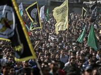 Mourners chant slogans as they carry the body of Palestinian Islamic Jihad senior leader Baha Abu Al-Ata during his funeral in Gaza City on November 12, 2019. Israel's military killed a commander of Palestinian militant group Islamic Jihad in a strike on his home in the Gaza Strip early, prompting retaliatory rocket fire and fears of a severe escalation in violence. MAHMUD HAMS / AFP