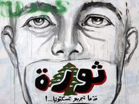 A graffiti reading "Revolution...even if you try to silence us" is sprayed on a wall in central Beirut on November 5, 2019. Since October 17, the chanting of tens of thousands of Lebanese denouncing the political elite have shaken the normally staid district around two Beirut squares, Martyrs' and Riad Al Solh. JOSEPH EID / AFP